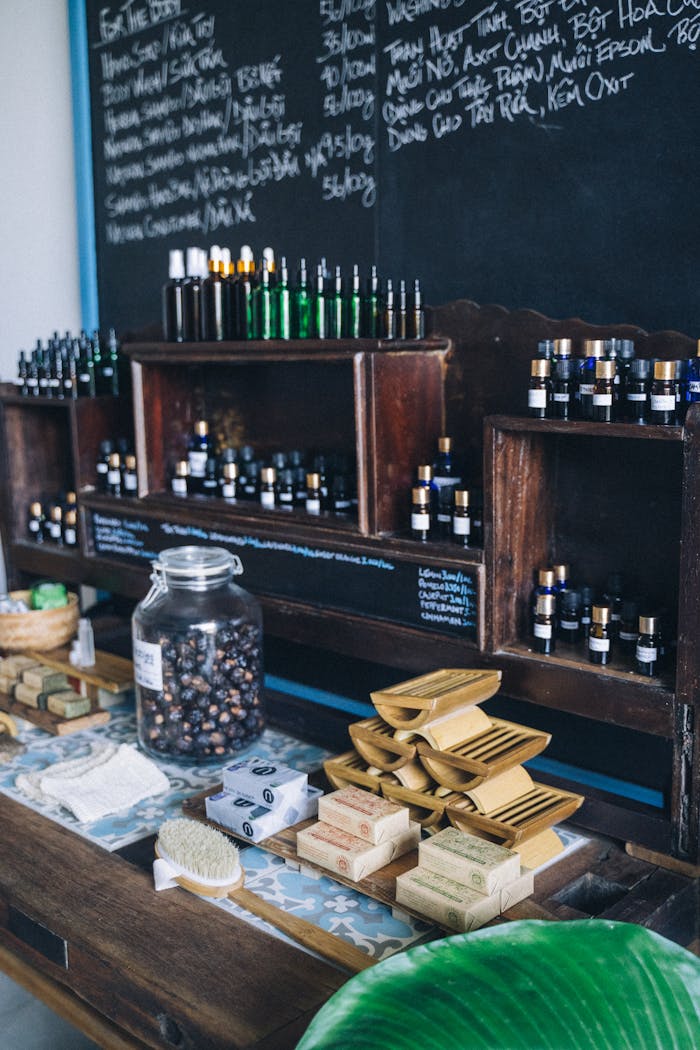 gallery-1 A display of essential oils and eco-friendly products in a natural wellness shop.